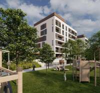 2i byt  A.3.1 - Bell Residence - Na ulici Suchoňova sú bytové domy obklopené zelenými stromami, pred ktorými sa nachádza ihrisko a ľudia.