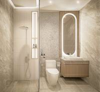 2 IZBOVÝ APARTMÁN (2 SPÁLNE + 1 OBÝV. IZBA) SEASPIRE JOMTIEN PATTAYA - Kúpeľňa 3-izbového bytu s minimalistickým dizajnom, sprchou a podsvieteným zrkadlom.