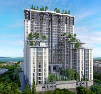 EMBASSY LIFE PATTAYA - Výstavba bytov v Pattayi s výhľadom na more a zeleňou na strechách budov.