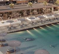 HOTELOVÝ SUITE V LUXUSNOM ZANZIBARSKOM KOMPLEKSE - Luxusný bazén a plážové ležadlá pred rodinným domom na pobreží.