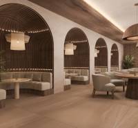 HOTELOVÝ SUITE V LUXUSNOM ZANZIBARSKOM KOMPLEKSE - Interiér rodinného domu s elegantnými kreslami, drevenými stolmi a zaujímavým osvetlením.