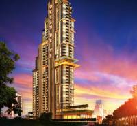 THE RIVIERA OCEAN DRIVE PATTAYA - Výstavba bytov v Pattayi s dominantným mrakodrapom pri západe slnka.