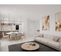 LOS ALCÁZARES -rekreačné apartmány s turistickou licenciou na prenájom - Interiér rekreačného apartmánu zahŕňa kuchyňu, jedálenský stôl, pohovku a dekorácie.