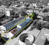 Budova vhodná na developérsky projekt | Vrbové - Letecký pohľad na priemyselnú budovu v meste Vrbové na ulici SNP.
