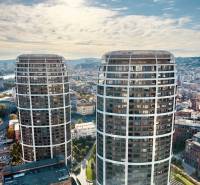 Prenájom 3-izbový byt s loggiou, SKY PARK, Bratislava - Dva moderné výškové budovy v Bratislave, s panorámou mesta v pozadí.