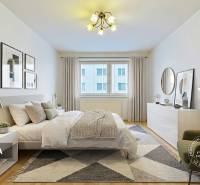 3-izbový byt S GARÁŽOU, Podolínec, ulica Družstevná - Spálňa v 3-izbovom byte s posteľou, kreslom a podlahou s dreveným dekorom.