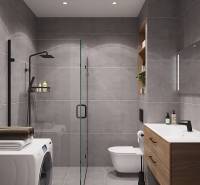 Pripravujeme: Moderná novostavba bytového domu, Byty Maty - Kúpeľňa so sprchovacím kútom, umývadlom a práčkou v 1-izbovom byte.