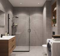 Pripravujeme: Moderná novostavba bytového domu, Byty Maty - Kúpeľňa so sprchovacím kútom, umývadlom, práčkou a poličkami v 1-izbovom byte.