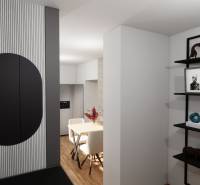 NA PREDAJ 3-IZBOVÝ RD (ČASŤ DVOJDOMU), ZEMIANSKA OLČA - Interiér rodinného domu s podlahou s dreveným dekorom, dekoráciami a jedálenským stolom.