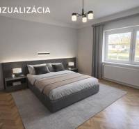 NA PREDAJ 5 izbový rodinný dom s veľkou záhradou v obci Iža - Spálňa v rodinnom dome s kobercovým dekorom a posteľou, veľké okno s výhľadom.