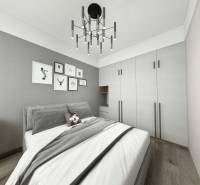 I Predaj 3- izbového bytu v Dúbravke - Spálňa v 3-izbovom byte s posteľou, šatníkovou skriňou a stenou s dekoráciami.