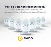 Na prenájom obchodný priestor + sklad, 120m2, FIRMBOX, Trenčín - Ocenenia realitnej kancelárie RADO Reality Group s nápismi a logom v pozadí.