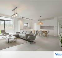 4-izbový rodinný dom Galanta – HODY - bez rezervačnej zálohy - Obývacia izba s kuchyňou, sivým nábytkom a jedálenským stolom v rodinnom dome.