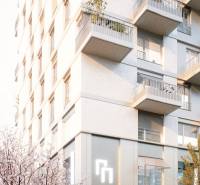 , 3-izbový byt s predzáhradkou, Brenner – Residence, Ružinov. - Bytový dom na Mlynských nivách v Bratislave - Ružinove s balkónmi a rozkvitnutými stromami.