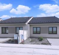 Predané - 4izbový rodinný dom (dvojdom) v obci Horná Potôň! - Dom v Hornej Potôni s tmavou strechou, dvomi oknami a priľahlou príjazdovou cestou.