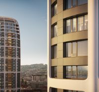 PRENÁJOM vnútorné parkovacie státie v garáži Sky Park – Tower 3 - Pohľad na moderné výškové budovy s panorámou Bratislavy z Továrenskej ulice.