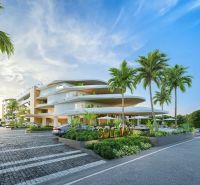 SOLE MIO RESIDENCES PHUKET - Výstavba bytov v Phukete s modernou architektúrou, obklopená palmami a parkovacou plochou.
