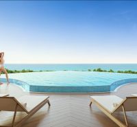 SOLE MIO RESIDENCES PHUKET - Bazén s výhľadom na more a lehátkami, Výstavba bytov v Phukete.