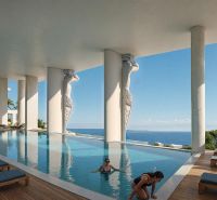 Predaj 5-izbového bytu, Zanzibar - Luxusný bazén v Paje s výhľadom na oceán a modernými sochami.