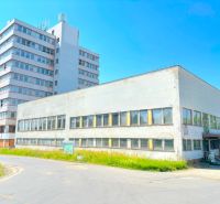 FORVIN TOWER - Predaj administratívnej budovy, Veľký Krtíš - Budova na ulici Liaz, Zvláštne nehnuteľnosti; starší dvojposchodový objekt vedľa výškovej stavby.