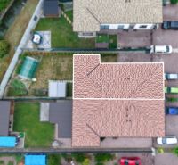 Moderný 3-izbový byt s terasou a parkovaním v Galante - Letecký pohľad na strechy a záhrady na Ulici Pri Derni v Galante.