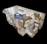 Garsónka po kompletnej rekonštrukcii v širšom centre mesta - Dizajn interiéru Rekreačného apartmánu s podlahou s dreveným dekorom a kompaktným usporiadaním.