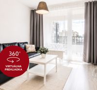 Pekný 2i byt, LODŽIA, GARÁŽ, PIVNICA, Dúbravka, Nejedlého - Obývacia izba v 2-izbovom byte s čiernou sedačkou, televízorom a balkónom.