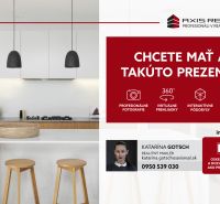 UZAMYKATEĽNÁ GARÁŽ 20m2 v NOVOSTAVBE Vodotika, Lužná ul. - Kuchyňa s ostrovčekom, bielymi skrinkami a podlahou s dreveným dekorom v 2-izbovom byte.