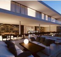 NEDOKONČENÝ BUTIKOVÝ HOTEL A POZEMOK V MATEMWE - Elegantná terasa s pohodlným sedením a dekoratívnou stenou v reštauračnej zóne Pozemky - komerčné.