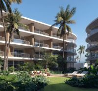 THE CORAL KOH SAMUI - Výstavba bytov v Surat Thani: apartmánové budovy s palmami a zeleňou na pozadí.