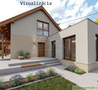 Dom s chalupárskou atmosférou s nadstavbou v peknom prostredí v obci Š - Rodinný dom v Šútovciach s modernou fasádou, záhradou a parkovaním v pozadí.