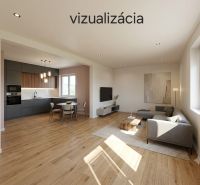 NA PREDAJ 4-izbový byt v procese rekonštrukcie – Želobudza - Interiér 4-izbového bytu s otvorenou kuchyňou a podlahou s dreveným dekorom.