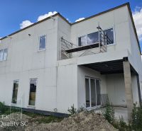 Okr. SeAnec - TOMÁŠOV - EXKLUZÍVNE NA PREDAJ NOVOSTAVBA - dva 4 izb. b - Stavebný rodinný dom v Tomášove s neomietnutou fasádou a balkónom.