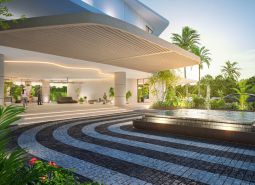 Architektonický vstup so záhradou a fontánou. Výstavba bytov v Phuket ponúka luxusné prostredie.