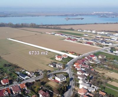 INVESTIČNÝ POZEMOK 6733 m² NA RD – SOKOLOVCE (okres Piešťany)