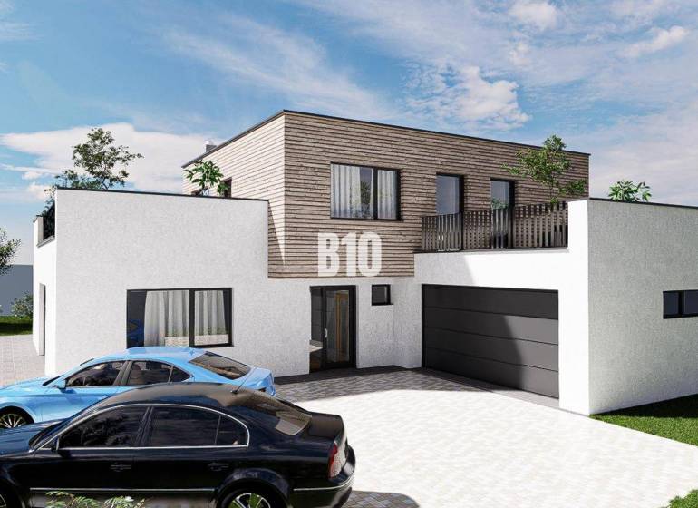 6 izbový rodinný dom  - DVOJGARÁŽ - CABAJ časť Riegler - Rodinný dom s jedným poschodím, garážou a dvoma autami, obklopený zeleňou.