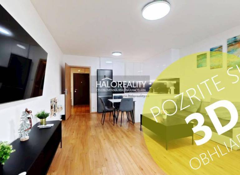 Predaj, dvojizbový byt Bratislava Ružinov, Trnavská ... - Obývačka v 2-izbovom byte s podlahou s dreveným dekorom, jedálňou a televíziou na stene.