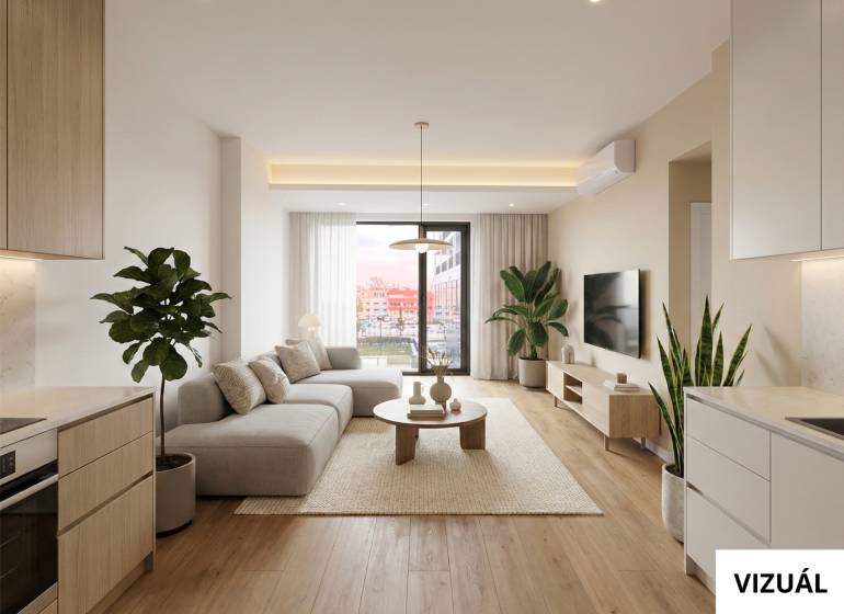 Na PREDAJ | 2 izb. ateliér | Prístavná ulica - Obývacia izba v 2-izbovom byte s podlahou s dreveným dekorom, pohodlnou sedačkou a rastlinami.