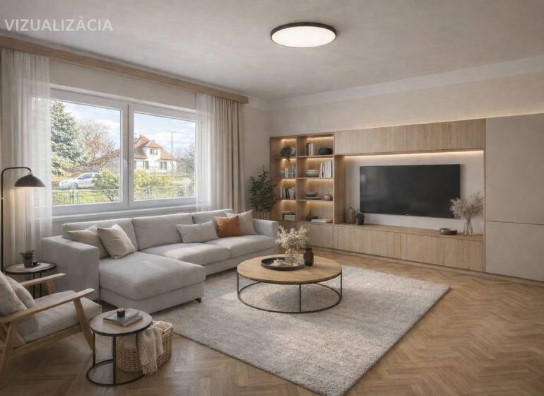 NA PREDAJ 5 izbový rodinný dom s veľkou záhradou v obci Iža - Obývačka v rodinnom dome s pohodlnou sedacou súpravou a podlahou s dreveným dekorom.