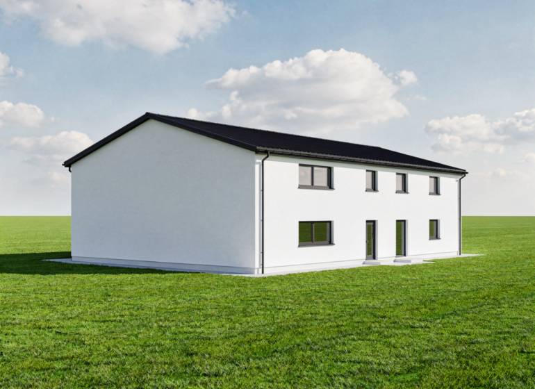 Predaj, výrobný a veľkoobchodný areál v okrese Veľký Krtíš - Výrobné priestory v meste Veľký Krtíš na zelenej lúke s modrou oblohou.