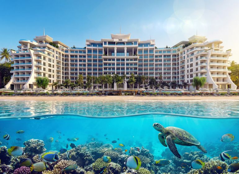 Predaj 3-izbového bytu, Zanzibar - Hotel pri pláži v Paje, v popredí korytnačka a pestrofarebné ryby.