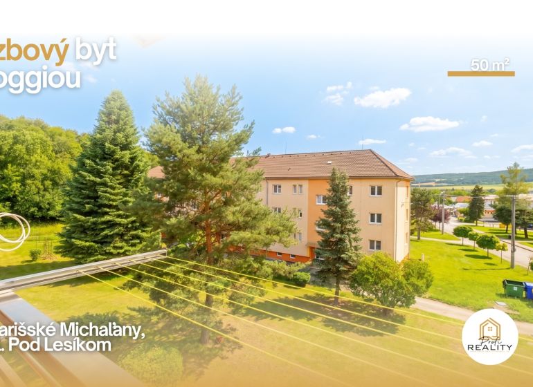 PREDAJ | 2-izb. byt 59 m² + loggia | Š. Michaľany - Zeleň a bytové domy na ulici Pod lesíkom v Šarišských Michaľanoch.