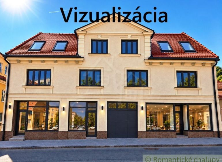 Multifunkčná budova v srdci Modrého Kameňa v okrese Veľký Krtíš - Fasáda budovy s obchodnými priestormi v meste Modrý Kameň, zachytávajúca presklené výklady.