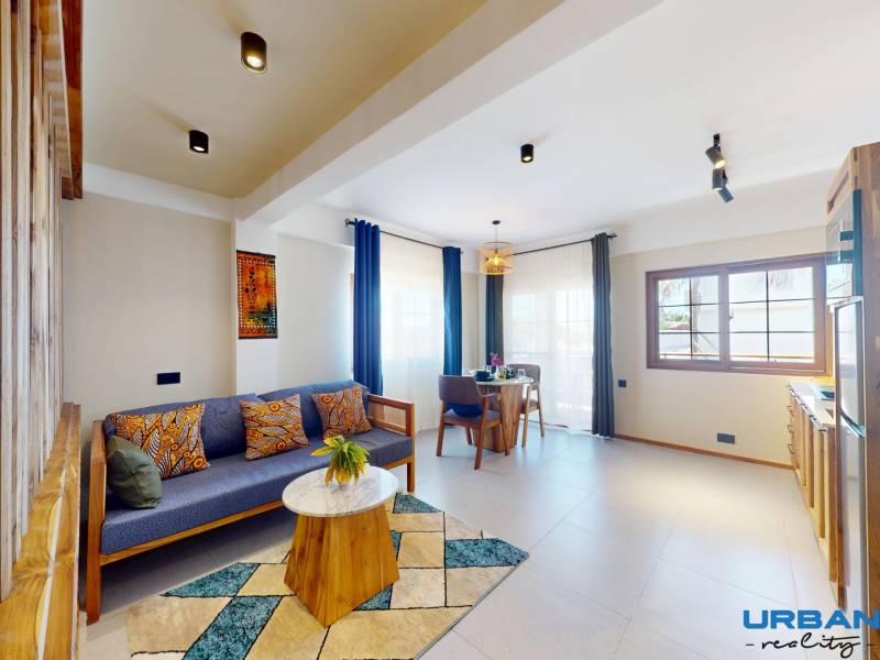APARTMÁN NA PREDAJ V PAJE, ZANZIBAR - Modern-studio-apartment-in-Zanzibar-Sofa-and-coffee-table.jpg