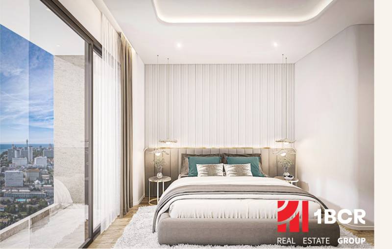 1 IZBOVÝ APARTMÁN (1 SPÁLŇA + 1 OBÝV. IZBA) SEASPIRE JOMTIEN PATTAYA - Spálňa v 2-izbovom byte s výhľadom na panorámu mesta Pattaya.