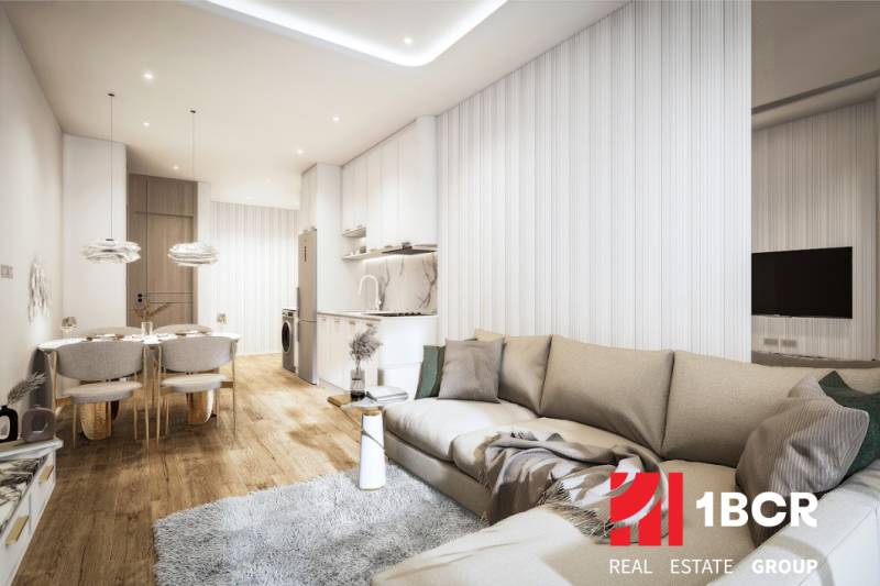 2 IZBOVÝ APARTMÁN (2 SPÁLNE + 1 OBÝV. IZBA) SEASPIRE JOMTIEN PATTAYA - Obývačka s kuchynským kútom, pohovkou a jedálenským stolom v 3-izbovom byte.