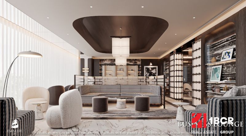 EMBASSY LIFE PATTAYA - Priestranný obývací priestor s kreslami, stojacou lampou a podlahou s dreveným dekorom.