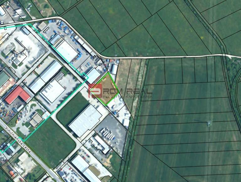 Prenájom spevnenej plochy - parking, skladovanie, Pezinok - Letecký pohľad na výrobné priestory v Pezinku obklopené poľnohospodárskou krajinou.