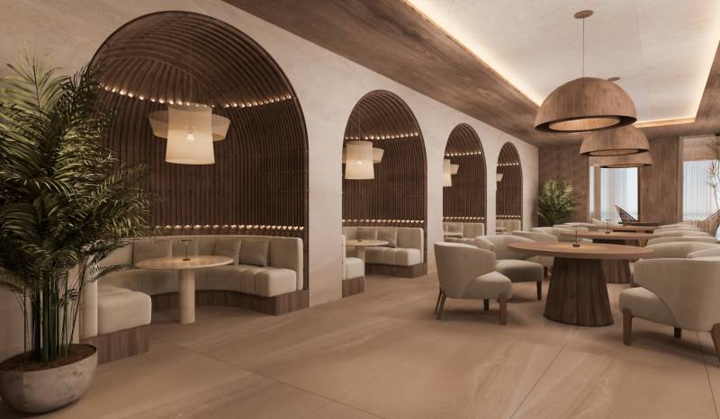 HOTELOVÝ SUITE V LUXUSNOM ZANZIBARSKOM KOMPLEKSE - Interiér rodinného domu s elegantnými kreslami, drevenými stolmi a zaujímavým osvetlením.