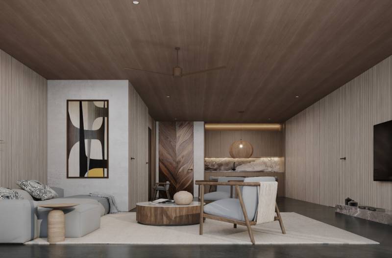 KRÁĽOVSKÝ APARTMÁN V LUXUSNOM ZANZIBARSKOM KOMPLEKSE - Interiér rodinného domu so sedačkou, kreslami a umeleckým dielom na stene.